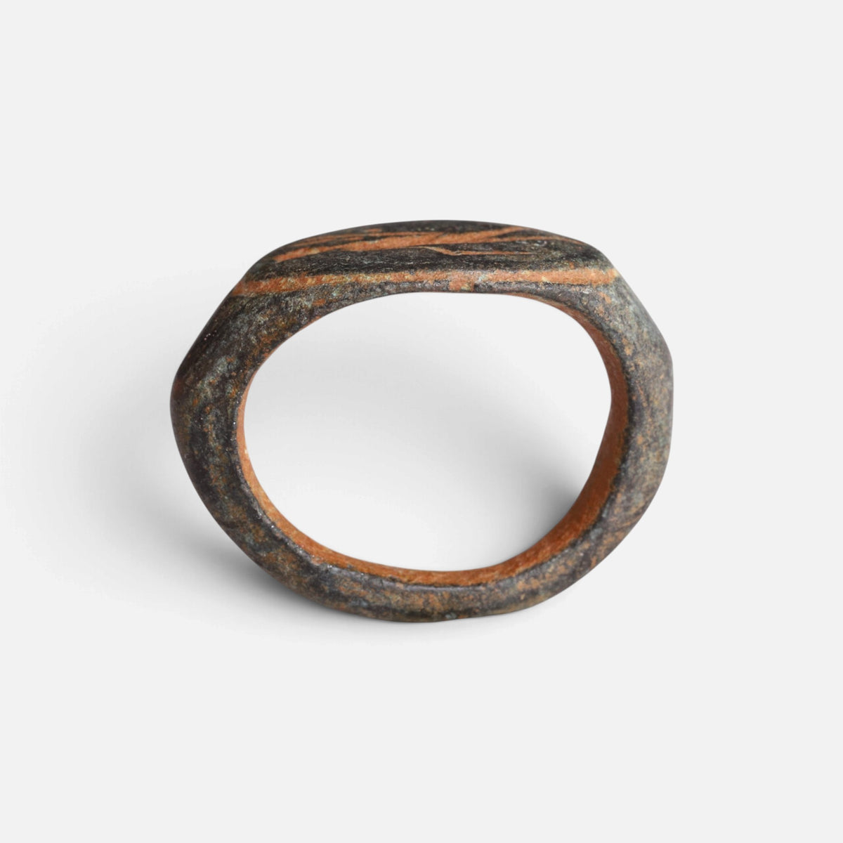 Roman bronze ring 'Mercurialis' shows its full hoop and the edge of its oval bezel in profile.