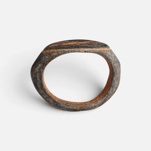 Roman bronze ring 'Mercurialis' shows its full hoop and the edge of its oval bezel in profile.