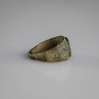 Interior view of Roman bronze ring Numerius showing burial patina and soil traces