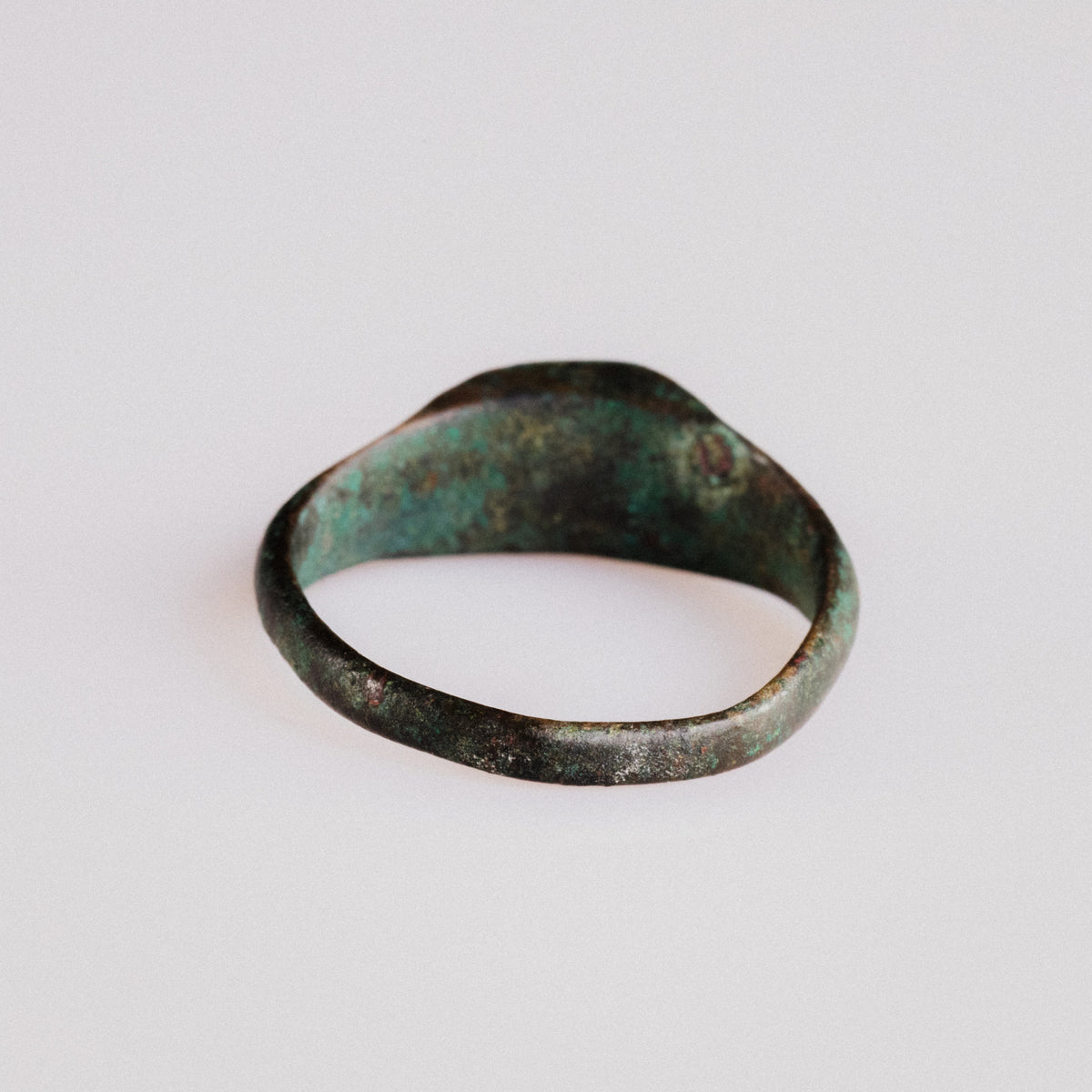 Interior view of Roman bronze ring Numerius showing hoop shape and ancient wear