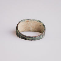Interior view of Roman bronze ring Palmata showing aged hoop and oval form