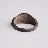 Interior view of Roman bronze ring Volusenus showing malachite and cuprite corrosion layers