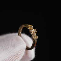 Macro detail of medieval bronze ring Cruciata highlighting Crusader cross iconography