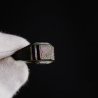 Macro view of Byzantine bronze ring Aetheria bezel engraving and cuprite patina