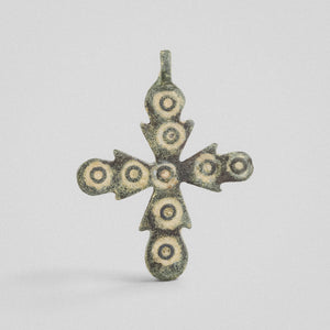 Medieval bronze cross pendant 'Rotunda' with nine ring-and-dot ornaments across budded arms, obverse view