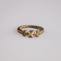 Medieval bronze Crusader ring Cruciata with cross pattée bezel viewed from above