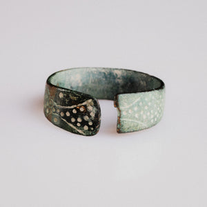 Medieval bronze flat-band ring Vesna with open terminals and punched-dot vine-scroll decoration