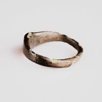 Medieval bronze ring Alderic from above with visible malachite and cuprite corrosion
