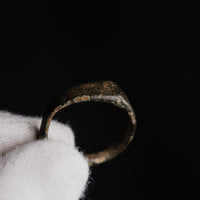 Medieval bronze ring Alderic profile view emphasising the tapering hoop shape