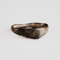 Medieval bronze ring Alderic shown from the front, revealing the tapering D-profile band