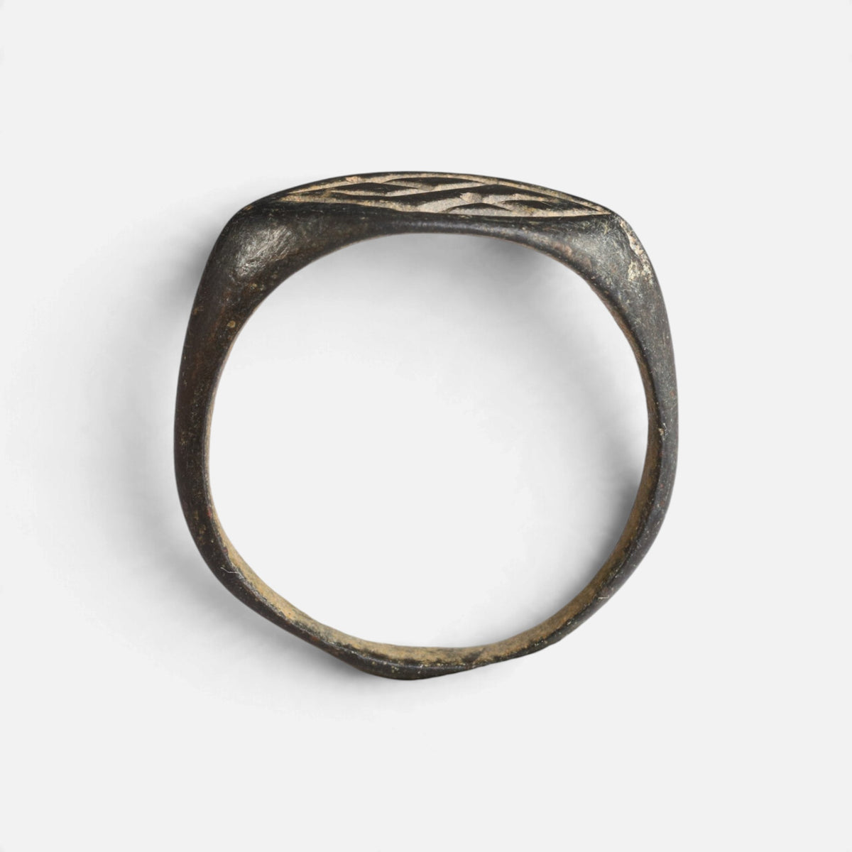Medieval bronze ring 'Aldhelm' shows its complete hoop and the thin navette bezel edge in profile.