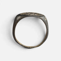 Medieval bronze ring 'Aldhelm' shows its complete hoop and the thin navette bezel edge in profile.