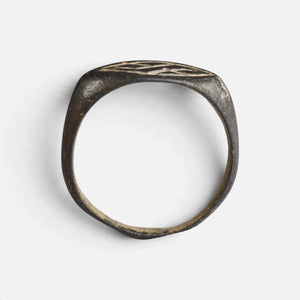 Medieval bronze ring 'Aldhelm' shows its complete hoop and the thin navette bezel edge in profile.