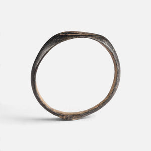 Medieval bronze ring 'Arnulf' shows its full hoop and the pointed oval bezel edge in profile.
