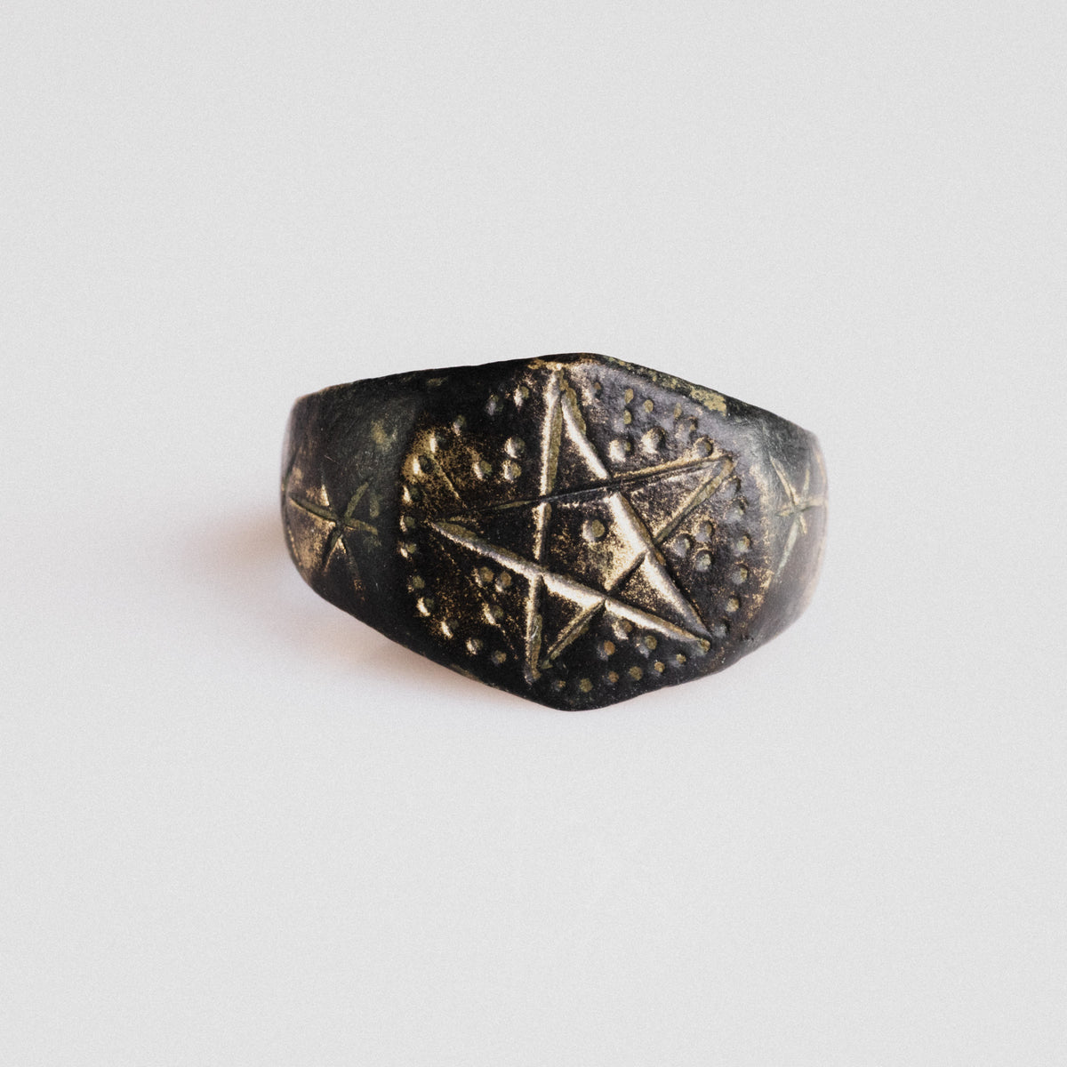Medieval bronze ring Astariel with engraved pentagram bezel and punched-dot border