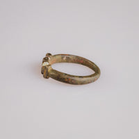 Medieval bronze ring Cruciata angled to show cross pattée and shoulder projections