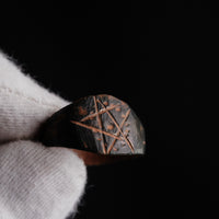 Medieval bronze ring Drudan macro shot of engraved bezel and dot punches