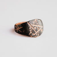 Medieval bronze ring Drudan side view showing shoulder star engraving and patina