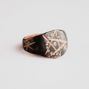 Medieval bronze ring Drudan side view showing shoulder star engraving and patina