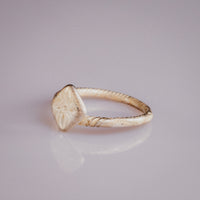 Medieval bronze ring Florentia angled view of engraved quatrefoil bezel and twisted band