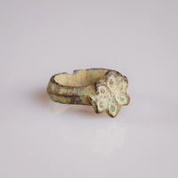 Medieval bronze ring Florian side view showing narrow D-section hoop and green patina