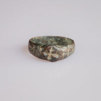 Medieval bronze ring Radenko with engraved cross pattée on the bezel, front view.