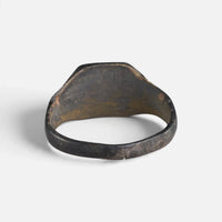 Medieval bronze ring 'Radomar' shows its inner shoulders and the plain back of the bezel.