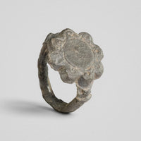 Medieval bronze ring Rosalind showing scrolled petals framing a plain central field