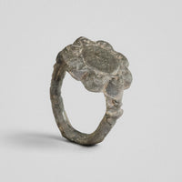 Medieval bronze ring Rosalind with eight-lobed rosette bezel, three-quarter view