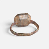 Medieval bronze ring 'Rutheris' shows the plain back of its setting and the inner hoop.