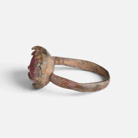 Medieval bronze ring 'Rutheris' shows its raised setting edge and thin hoop from the opposite side.