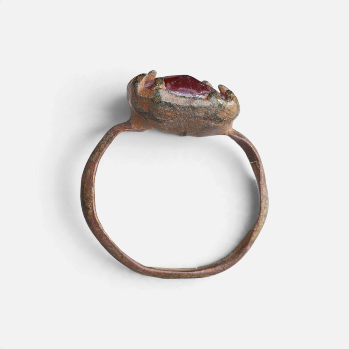 Medieval bronze ring 'Rutheris' shows its raised setting above the full hoop in profile.