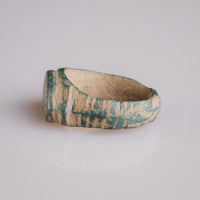 Medieval bronze ring Tamgar, angled view of ribbed shoulder and bezel edge