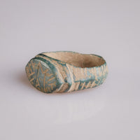 Medieval bronze ring Tamgar, top view of oval bezel with geometric M motif
