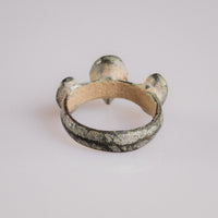 Medieval bronze ring 'Trivena' rear view showing the smooth hoop and radial bezel arrangement