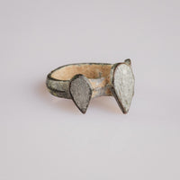 Medieval bronze ring 'Trivena' three-quarter view revealing the plain D-section hoop and central bezel