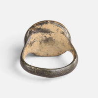 Medieval bronze ring 'Ventaris' shows the plain back of its oval bezel and the inner hoop.