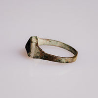 Medieval bronze ring Vespertin angled view of the glass paste cabochon and eroded bezel rim
