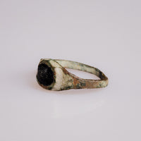Medieval bronze ring Vespertin opposite side showing dark glass stone and cuprite tones