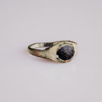 Medieval bronze ring Vespertin three-quarter view showing thin hoop and integral bezel