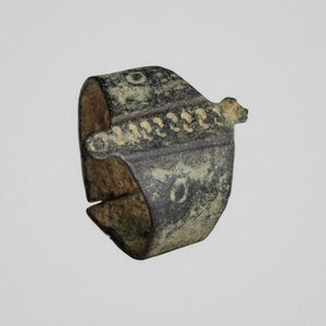 Medieval bronze ring Wistanoc, front view of gabled band with punched S-shaped crescents