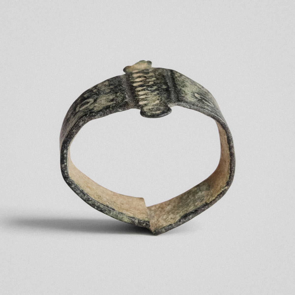 Medieval bronze ring Wistanoc, profile view showing open back and overlapping ends