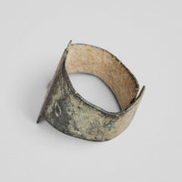 Medieval bronze ring Wistanoc, side view showing patina and punched shoulder annulet