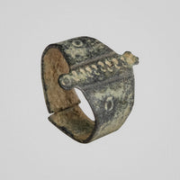 Medieval bronze ring Wistanoc, three-quarter view showing raised transverse bar and projecting tabs