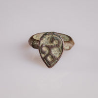 Medieval bronze shield-bezel ring Vetka with engraved tree of life motif, top view
