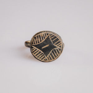 Medieval bronze signet ring Aldric with engraved four-pointed star and hatched quadrants on disc bezel