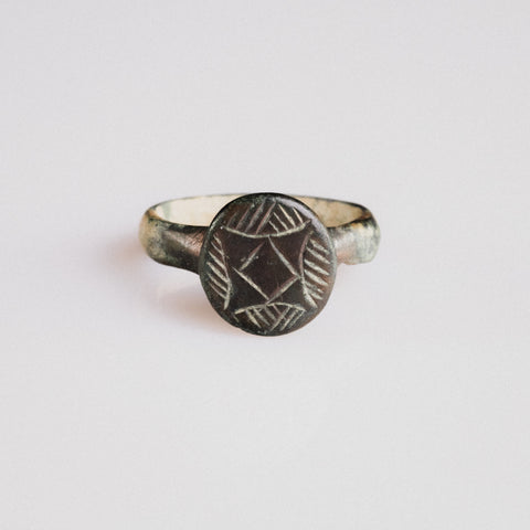 Medieval bronze signet ring 'Aldric' with engraved quatrefoil bezel, top view