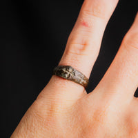 Medieval bronze ring Radenko worn on a finger, angled view showing the band on the hand
