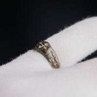 Medieval bronze ring Radenko on a gloved hand, second angle of the cross decoration