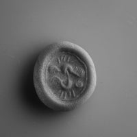Putty impression of the medieval silver seal ring Wistrid, showing the S-whirl device raised